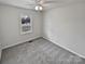 Charming bedroom with grey carpet and a window offering street view at 165 Bowman Rd, Statesville, NC 28625