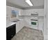 White kitchen with ample counter space and black dishwasher at 165 Bowman Rd, Statesville, NC 28625