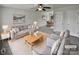 Virtually staged living room with light gray couch and coffee table at 165 Bowman Rd, Statesville, NC 28625