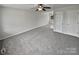 Spacious living room with gray carpeting and neutral walls at 165 Bowman Rd, Statesville, NC 28625