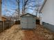 Gray storage shed in the backyard of the property at 165 Bowman Rd, Statesville, NC 28625