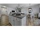 Island kitchen with granite countertops and white cabinets at 176 Briana Marie Way, Indian Trail, NC 28079