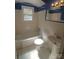 Clean bathroom with a tub, toilet and pedestal sink at 1814 Logie Ave, Charlotte, NC 28205