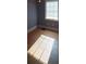 Simple bedroom with hardwood floors and a window at 1814 Logie Ave, Charlotte, NC 28205