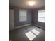 Spacious bedroom with neutral walls and carpeted floors at 1814 Logie Ave, Charlotte, NC 28205