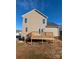 Backyard view of a two-story home featuring a wooden deck and a large grassy area at 1875 Terrain Nw Dr, Conover, NC 28613