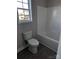 Bathroom featuring a shower/tub combo, toilet, and a window for natural light at 1875 Terrain Nw Dr, Conover, NC 28613