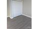 Bedroom featuring a large closet and wood-look flooring throughout at 1875 Terrain Nw Dr, Conover, NC 28613