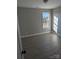 Bedroom featuring a window providing natural light; wood-look flooring throughout at 1875 Terrain Nw Dr, Conover, NC 28613