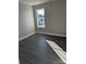 Bedroom featuring a window providing natural light; wood-look flooring throughout at 1875 Terrain Nw Dr, Conover, NC 28613