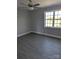 Bedroom featuring a ceiling fan and window providing natural light; wood-look flooring at 1875 Terrain Nw Dr, Conover, NC 28613