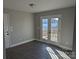 Bright dining room with wood floors and a glass door leading to an outdoor deck at 1875 Terrain Nw Dr, Conover, NC 28613