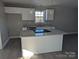 Kitchen area featuring stainless steel appliances, light wood flooring and bright lighting at 1875 Terrain Nw Dr, Conover, NC 28613