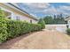 Landscaped backyard with a privacy hedge and grassy area at 201 Waterlynn Ridge Rd # E, Mooresville, NC 28117