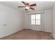 Spacious bedroom with ceiling fan and neutral carpeting at 201 Waterlynn Ridge Rd # E, Mooresville, NC 28117