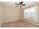 Bright bedroom with ceiling fan and neutral carpeting at 201 Waterlynn Ridge Rd # E, Mooresville, NC 28117