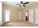 Bedroom with private door to bathroom and carpet at 201 Waterlynn Ridge Rd # E, Mooresville, NC 28117