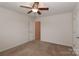 Bright bedroom with ceiling fan and neutral decor at 201 Waterlynn Ridge Rd # E, Mooresville, NC 28117