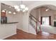 Dining room with hardwood floors, kitchen pass-through, and view of living room at 201 Waterlynn Ridge Rd # E, Mooresville, NC 28117