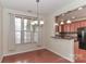 Bright dining area with hardwood floors and a view of the kitchen at 201 Waterlynn Ridge Rd # E, Mooresville, NC 28117