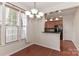 Well-lit dining area with hardwood floors and kitchen access at 201 Waterlynn Ridge Rd # E, Mooresville, NC 28117