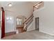 Bright entryway with high ceilings, hardwood floors, and views to the dining and living areas at 201 Waterlynn Ridge Rd # E, Mooresville, NC 28117