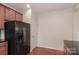 Kitchen with black refrigerator and pantry at 201 Waterlynn Ridge Rd # E, Mooresville, NC 28117