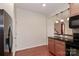 Kitchen with breakfast bar and black appliances at 201 Waterlynn Ridge Rd # E, Mooresville, NC 28117