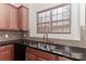 Kitchen sink with granite countertops and tile backsplash at 201 Waterlynn Ridge Rd # E, Mooresville, NC 28117