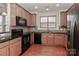 Modern kitchen with granite countertops and stainless steel appliances at 201 Waterlynn Ridge Rd # E, Mooresville, NC 28117