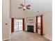 Living room with fireplace, high ceiling, and sliding doors at 201 Waterlynn Ridge Rd # E, Mooresville, NC 28117