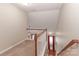 Upstairs hallway with carpeted flooring and railing at 201 Waterlynn Ridge Rd # E, Mooresville, NC 28117