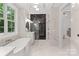 Elegant bathroom with soaking tub, walk-in shower, and modern fixtures at 209 E Glenview Dr, Salisbury, NC 28147