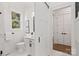 Clean bathroom with white vanity, toilet, and a sliding barn door at 209 E Glenview Dr, Salisbury, NC 28147