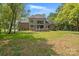 Brick house with large backyard, patio, and mature trees at 209 E Glenview Dr, Salisbury, NC 28147