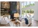 Bright living room with stone fireplace and sliding glass doors at 209 E Glenview Dr, Salisbury, NC 28147