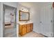 Main bathroom with a vanity, mirror, and tiled floors at 209 Squirrel Ln, Lake Wylie, SC 29710