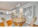 Charming breakfast nook features a round wooden table with four chairs at 209 Squirrel Ln, Lake Wylie, SC 29710