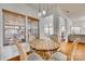 Bright breakfast nook with wooden table and four chairs, adjacent to kitchen at 209 Squirrel Ln, Lake Wylie, SC 29710