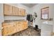 Laundry room with wooden cabinets and granite countertops at 209 Squirrel Ln, Lake Wylie, SC 29710