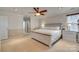 Bright main bedroom featuring a ceiling fan and large windows at 209 Squirrel Ln, Lake Wylie, SC 29710