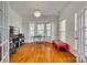 Home office with hardwood floors, built-in shelving, and bay window at 209 Squirrel Ln, Lake Wylie, SC 29710