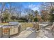 Spacious backyard deck with a built-in grill and seating area at 2228 Valencia Ter, Charlotte, NC 28226