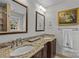 Double vanity bathroom with granite countertops and large mirrors at 2228 Valencia Ter, Charlotte, NC 28226