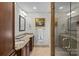 Double vanity bathroom with granite countertops and a shower at 2228 Valencia Ter, Charlotte, NC 28226