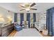 Well-lit bedroom featuring hardwood floors and ample closet space at 2228 Valencia Ter, Charlotte, NC 28226