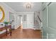 Entryway with brick flooring, green door, and view into the living area at 2228 Valencia Ter, Charlotte, NC 28226