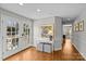 Bright hallway with French doors leading to backyard at 2228 Valencia Ter, Charlotte, NC 28226