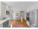 Kitchen features stainless steel appliances and hardwood floors at 2228 Valencia Ter, Charlotte, NC 28226