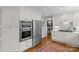 Modern kitchen with stainless steel appliances and white cabinets at 2228 Valencia Ter, Charlotte, NC 28226